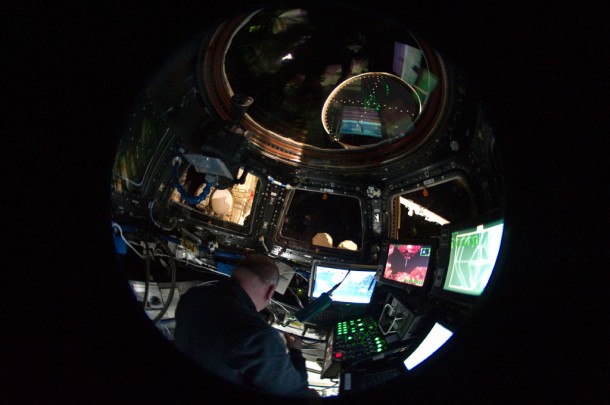 In this "fish-eye" lens view, STS-132 Mission Specialist Garrett Reisman is surrounded by windows and computers in the International Space Station's cupola. Image credit: NASA In this "fish-eye" lens view, STS-132 Mission Specialist Garrett Reisman is surrounded by windows and computers in the International Space Station's cupola. Image credit: NASA