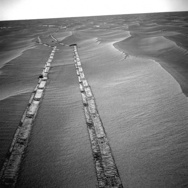 NASA's Mars Exploration Rover Opportunity used its navigation camera for this northward view of tracks the rover left on a drive from one energy-favorable position on the northern end of a sand ripple to another. Image credit: NASA/JPL-Caltech NASA's Mars Exploration Rover Opportunity used its navigation camera for this northward view of tracks the rover left on a drive from one energy-favorable position on the northern end of a sand ripple to another. Image credit: NASA/JPL-Caltech