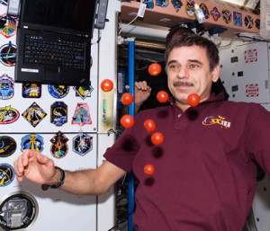 Cosmonaut and Flight Engineer Mikhail Kornienko plays with floating fresh tomatoes inside the station’s Unity Node. Credit: NASA Cosmonaut and Flight Engineer Mikhail Kornienko plays with floating fresh tomatoes inside the station’s Unity Node. Credit: NASA
