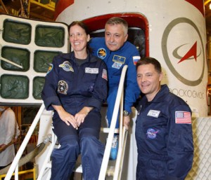 The new Expedition 24 crew members sit outside the Soyuz TMA-19 during their fit check. From left are Flight Engineers Shannon Walker, Fyodor Yurchikhin and Doug Wheelock. Credit: NASA The new Expedition 24 crew members sit outside the Soyuz TMA-19 during their fit check. From left are Flight Engineers Shannon Walker, Fyodor Yurchikhin and Doug Wheelock. Credit: NASA