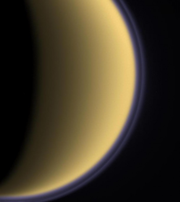 A new study by CU-Boulder researchers indicates a thick organic haze shrouding Earth several billion years ago was similar to the one now hovering over Saturn’s largest moon, Titan and may have protected primordial life on the planet from damaging ultraviolet radiation. Credit: NASA/JPL/Space Science Institute. A new study by CU-Boulder researchers indicates a thick organic haze shrouding Earth several billion years ago was similar to the one now hovering over Saturn’s largest moon, Titan and may have protected primordial life on the planet from damaging ultraviolet radiation. Credit: NASA/JPL/Space Science Institute.