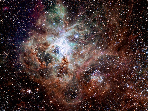 This first light image of the TRAPPIST national telescope at La Silla shows the Tarantula Nebula, located in the Large Magellanic Cloud (LMC) — one of the galaxies closest to us. Also known as 30 Doradus or NGC 2070, the nebula owes its name to the arrangement of bright patches that somewhat resembles the legs of a tarantula. Credit: TRAPPIST/E. Jehin/ESO This first light image of the TRAPPIST national telescope at La Silla shows the Tarantula Nebula, located in the Large Magellanic Cloud (LMC) — one of the galaxies closest to us. Also known as 30 Doradus or NGC 2070, the nebula owes its name to the arrangement of bright patches that somewhat resembles the legs of a tarantula. Credit: TRAPPIST/E. Jehin/ESO