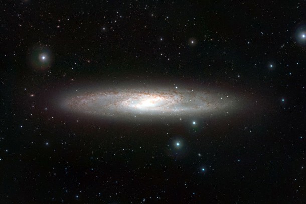 NGC 253 is one of the closest galaxies to our own. It is a bright spiral that lies about 13 million light-years from Earth in the southern constellation of Sculptor and is noted for being a starburst galaxy with very vigorous star formation and very dusty spiral arms. Credit: ESO NGC 253 is one of the closest galaxies to our own. It is a bright spiral that lies about 13 million light-years from Earth in the southern constellation of Sculptor and is noted for being a starburst galaxy with very vigorous star formation and very dusty spiral arms. Credit: ESO