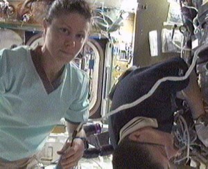 Flight Engineers Tracy Caldwell Dyson and Doug Wheelock work with the Carbon Dioxide Removal Assembly in the International Space Station. Credit: NASA TV Flight Engineers Tracy Caldwell Dyson and Doug Wheelock work with the Carbon Dioxide Removal Assembly in the International Space Station. Credit: NASA TV