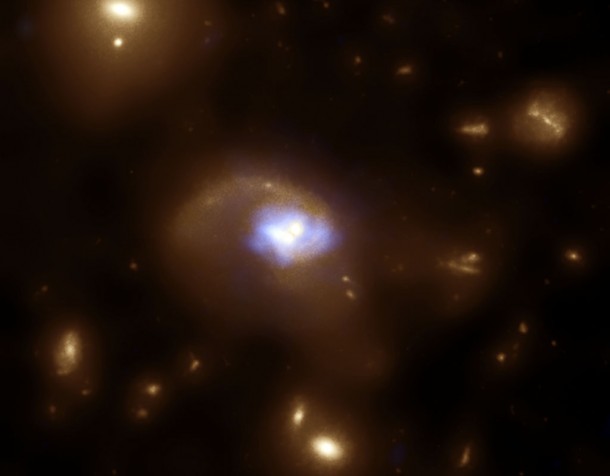 An unusual object was discovered in the Cosmic Evolution Survey, a large multi-wavelength study. Credit X-ray: NASA/CXC/SAO/F.Civano et al. Optical: NASA/STScI An unusual object was discovered in the Cosmic Evolution Survey, a large multi-wavelength study. Credit X-ray: NASA/CXC/SAO/F.Civano et al. Optical: NASA/STScI