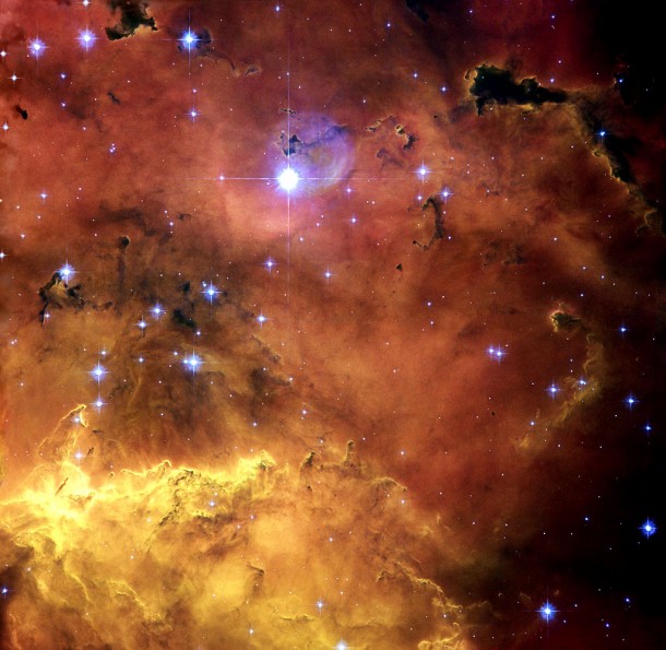 A colourful star-forming region is featured in this stunning new NASA/ESA Hubble Space Telescope image of NGC 2467. Looking like a roiling cauldron of some exotic cosmic brew, huge clouds of gas and dust are sprinkled with bright blue, hot young stars. Credit: NASA, ESA and Orsola De Marco (Macquarie University) A colourful star-forming region is featured in this stunning new NASA/ESA Hubble Space Telescope image of NGC 2467. Looking like a roiling cauldron of some exotic cosmic brew, huge clouds of gas and dust are sprinkled with bright blue, hot young stars. Credit: NASA, ESA and Orsola De Marco (Macquarie University)