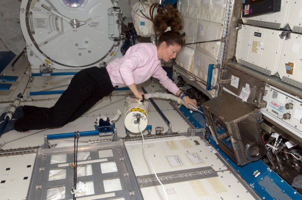 NASA astronaut Tracy Caldwell Dyson, Expedition 24 flight engineer, uses a vacuum cleaner during housekeeping operations in the Kibo laboratory of the International Space Station. Credit: NASA NASA astronaut Tracy Caldwell Dyson, Expedition 24 flight engineer, uses a vacuum cleaner during housekeeping operations in the Kibo laboratory of the International Space Station. Credit: NASA