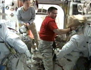 Flight Engineers Tracy Caldwell Dyson (left) and Doug Wheelock prepare spacesuits in the Quest airlock of the International Space Station. Credit: NASA Flight Engineers Tracy Caldwell Dyson (left) and Doug Wheelock prepare spacesuits in the Quest airlock of the International Space Station. Credit: NASA