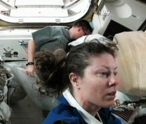 Flight Engineers Tracy Caldwell Dyson (foreground) and Doug Wheelock work inside the Quest airlock preparing for Saturday morning's spacewalk. Credit: NASA TV Flight Engineers Tracy Caldwell Dyson (foreground) and Doug Wheelock work inside the Quest airlock preparing for Saturday morning's spacewalk. Credit: NASA TV