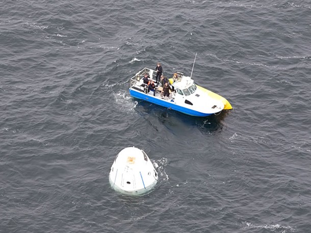 One of three recovery boats approaches Dragon spacecraft after it has completed its decent. Photo Credit: Chris Thompson/SpaceX. One of three recovery boats approaches Dragon spacecraft after it has completed its decent. Photo Credit: Chris Thompson/SpaceX.