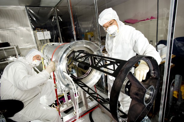 Ed West (NASA) and Ken Kobayashi (University of Alabama in Huntsville) put the finishing touches on SUMI prior to buttoning up the outer skin of the telescope. (NASA/MSFC/E. Given) Ed West (NASA) and Ken Kobayashi (University of Alabama in Huntsville) put the finishing touches on SUMI prior to buttoning up the outer skin of the telescope. (NASA/MSFC/E. Given)