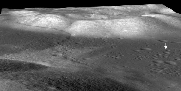 The mare basalts that fill the Taurus-Littrow valley were thrust up by contractional forces to form the Lee-Lincoln fault scarp, just west of the Apollo 17 landing site (arrow). It is the only extraterrestrial fault scarp to be explored by humans (astronauts Eugene Cernan and Harrison Schmitt). The digital terrain model derived from Lunar Reconnaissance Orbiter Camera (LROC) stereo images shows the fault extending upslope into North Massif were highlands material are also thrust up. The fault cuts upslope and abruptly changes orientation and cuts along slope, forming a narrow bench. LROC images show boulders shed from North Massif that have rolled downhill and collected on the bench. Credit: NASA/Goddard/Arizona State University/Smithsonian The mare basalts that fill the Taurus-Littrow valley were thrust up by contractional forces to form the Lee-Lincoln fault scarp, just west of the Apollo 17 landing site (arrow). It is the only extraterrestrial fault scarp to be explored by humans (astronauts Eugene Cernan and Harrison Schmitt). The digital terrain model derived from Lunar Reconnaissance Orbiter Camera (LROC) stereo images shows the fault extending upslope into North Massif were highlands material are also thrust up. The fault cuts upslope and abruptly changes orientation and cuts along slope, forming a narrow bench. LROC images show boulders shed from North Massif that have rolled downhill and collected on the bench. Credit: NASA/Goddard/Arizona State University/Smithsonian