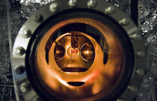 A small PETE device made with cesium-coated gallium nitride glows while being tested inside an ultra-high vacuum chamber. The tests proved that the process simultaneously converted light and heat energy into electrical current. Credit: Stanford University A small PETE device made with cesium-coated gallium nitride glows while being tested inside an ultra-high vacuum chamber. The tests proved that the process simultaneously converted light and heat energy into electrical current. Credit: Stanford University