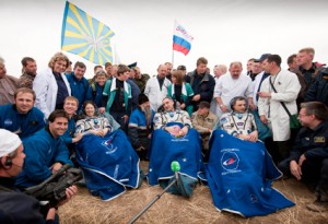 Expedition 24 Flight Engineers Tracy Caldwell Dyson, left, Commander Alexander Skvortsov, center and Mikhail Kornienko sit in chairs outside the Soyuz Capsule just minutes after they landed near the town of Arkalyk, Kazakhstan on Saturday, Sept. 25, 2010. Credit: NASA/Bill Ingalls Expedition 24 Flight Engineers Tracy Caldwell Dyson, left, Commander Alexander Skvortsov, center and Mikhail Kornienko sit in chairs outside the Soyuz Capsule just minutes after they landed near the town of Arkalyk, Kazakhstan on Saturday, Sept. 25, 2010. Credit: NASA/Bill Ingalls
