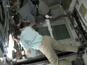 Expedition 25 Commander Doug Wheelock (top) and Flight Engineer Shannon Walker perform maintenance on the International Space Station's treadmill. Credit: NASA TV Expedition 25 Commander Doug Wheelock (top) and Flight Engineer Shannon Walker perform maintenance on the International Space Station's treadmill. Credit: NASA TV