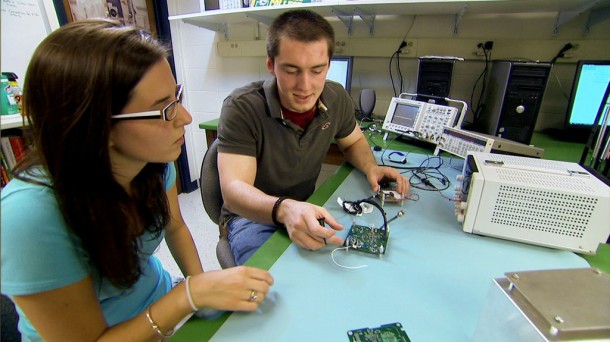 Jennifer Williams and Robert Carroll, Undergraduate Physics Students at Siena College Loudonville, N.Y., work on instrument electronics for the Firefly mission. Jennifer Williams and Robert Carroll, Undergraduate Physics Students at Siena College Loudonville, N.Y., work on instrument electronics for the Firefly mission.