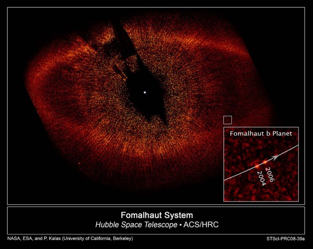 Simulated images of the ancient Kuiper Belt bear a striking resemblance to this Hubble Space Telescope view of the dusty ring around Fomalhaut, a young star located 25 light-years away in the constellation Piscis Austrinus. In 2008, Hubble spotted a planet orbiting inside the ring. The bright central star is masked out so that the faint ring can be seen. Credit: NASA/ESA/P. Kalas (Univ. of California, Berkeley) et al. Simulated images of the ancient Kuiper Belt bear a striking resemblance to this Hubble Space Telescope view of the dusty ring around Fomalhaut, a young star located 25 light-years away in the constellation Piscis Austrinus. In 2008, Hubble spotted a planet orbiting inside the ring. The bright central star is masked out so that the faint ring can be seen. Credit: NASA/ESA/P. Kalas (Univ. of California, Berkeley) et al.
