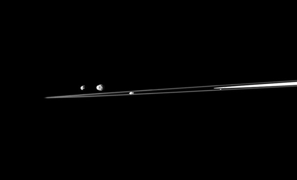 A quartet of Saturn's moons are shown with a sliver of the rings in this Cassini spacecraft view. Credit: NASA/JPL/Space Science Institute A quartet of Saturn's moons are shown with a sliver of the rings in this Cassini spacecraft view. Credit: NASA/JPL/Space Science Institute