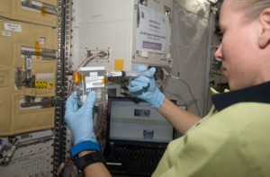 Flight Engineer Shannon Walker works with the Japan Aerospace Exploration Agency experiment HydroTropi in the Kibo laboratory of the International Space Station. Credit: NASA Flight Engineer Shannon Walker works with the Japan Aerospace Exploration Agency experiment HydroTropi in the Kibo laboratory of the International Space Station. Credit: NASA