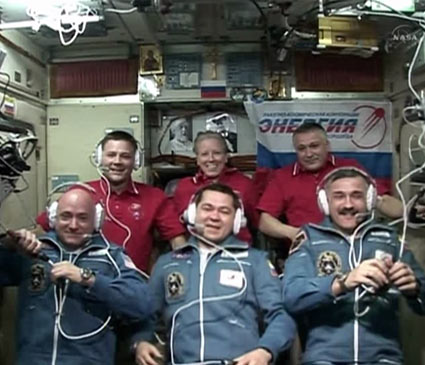The six-member Expedition 25 crew speaks to well-wishers and mission officials shortly after hatch opening. Photo credit: NASA TV The six-member Expedition 25 crew speaks to well-wishers and mission officials shortly after hatch opening. Photo credit: NASA TV