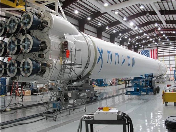 The Falcon 9 Demonstration Flight 2 vehicle undergoing final integration in the hangar at Cape Canaveral. Photo: SpaceX. The Falcon 9 Demonstration Flight 2 vehicle undergoing final integration in the hangar at Cape Canaveral. Photo: SpaceX.