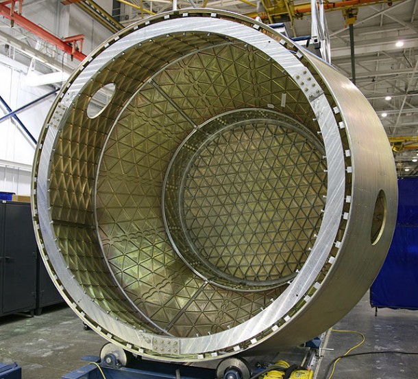 The pressure vessel for the next COTS Dragon spacecraft takes shape in Hawthorne. This arrived as a shipment of flat aluminum stock. We machined the triangular isogrid pattern, curved them into conic sections, and welded them into a vessel. By performing extensive production in-house SpaceX keeps costs low, quality high, and production timing streamlined. Photo: SpaceX. The pressure vessel for the next COTS Dragon spacecraft takes shape in Hawthorne. This arrived as a shipment of flat aluminum stock. We machined the triangular isogrid pattern, curved them into conic sections, and welded them into a vessel. By performing extensive production in-house SpaceX keeps costs low, quality high, and production timing streamlined. Photo: SpaceX.