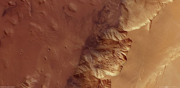 To the left of the image is Melas Chasma, a part of the huge Valles Marineris rift valley, which stretches for more than 4000 km across the face of Mars. Melas Chasma itself sinks 9 km below the surrounding plains, on the right of the image, making it one of the lowest depressions on Mars. This image covers 200 x 100 km and covers an area of roughly 20 000 sq km, which is about the size of Slovenia. Credits: ESA/DLR/FU Berlin (G. Neukum) To the left of the image is Melas Chasma, a part of the huge Valles Marineris rift valley, which stretches for more than 4000 km across the face of Mars. Melas Chasma itself sinks 9 km below the surrounding plains, on the right of the image, making it one of the lowest depressions on Mars. This image covers 200 x 100 km and covers an area of roughly 20 000 sq km, which is about the size of Slovenia. Credits: ESA/DLR/FU Berlin (G. Neukum)