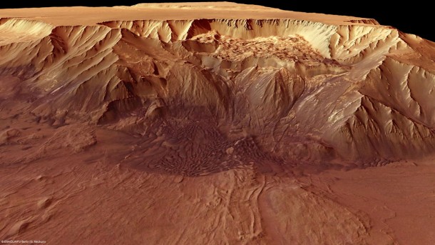 Melas Chasma is part of the huge Valles Marineris rift valley on Mars. Melas Chasma itself sinks 9 km below the surrounding surface, making it one of the lowest depressions on the planet. Landslides have created huge fans of rubble at the base of the cliff. Credits: ESA/DLR/FU Berlin (G. Neukum) Melas Chasma is part of the huge Valles Marineris rift valley on Mars. Melas Chasma itself sinks 9 km below the surrounding surface, making it one of the lowest depressions on the planet. Landslides have created huge fans of rubble at the base of the cliff. Credits: ESA/DLR/FU Berlin (G. Neukum)