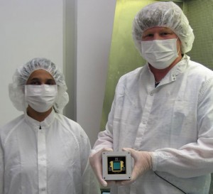NASA JPL's Mike Ressler, MIRI project scientist (right) and Kalyani Sukhatme, Focal Plane Module project element manager, in a clean room with the model of the MIRI detector. Credit: NASA NASA JPL's Mike Ressler, MIRI project scientist (right) and Kalyani Sukhatme, Focal Plane Module project element manager, in a clean room with the model of the MIRI detector. Credit: NASA