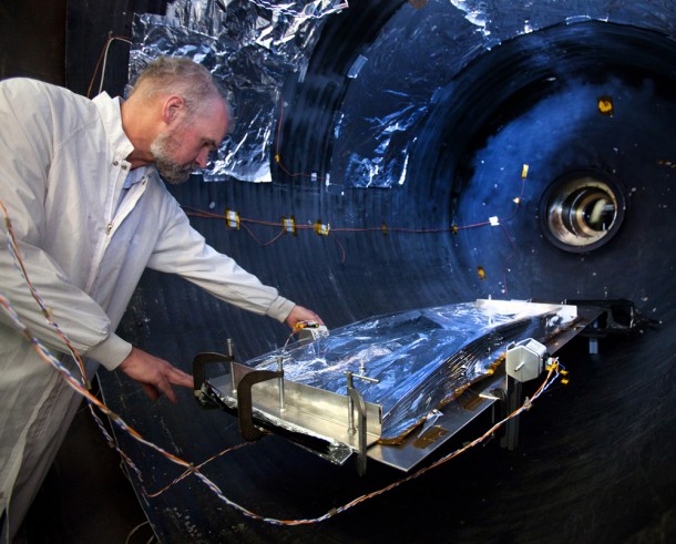 Northrop Grumman Lead Venting Analyst Dan McGregor with a sunshield test article as it is placed in the vacuum chamber at Aerospace Systems' test facility in Redondo Beach, Calif. Credit: Northrop Grumman Aerospace Systems Northrop Grumman Lead Venting Analyst Dan McGregor with a sunshield test article as it is placed in the vacuum chamber at Aerospace Systems' test facility in Redondo Beach, Calif. Credit: Northrop Grumman Aerospace Systems