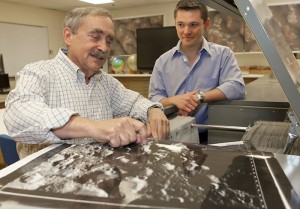 Peter Schultz and graduate student Brendan Hermalyn analyzed data from bits of the Moon’s surface kicked up by a NASA-engineered collision. They found unexpected complexity — and traces of silver. Credit: Mike Cohea/Brown University Peter Schultz and graduate student Brendan Hermalyn analyzed data from bits of the Moon’s surface kicked up by a NASA-engineered collision. They found unexpected complexity — and traces of silver. Credit: Mike Cohea/Brown University