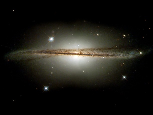 A Galaxy Playing Twister. Credit: NASA/ESA and The Hubble Heritage Team STScI/AURA)