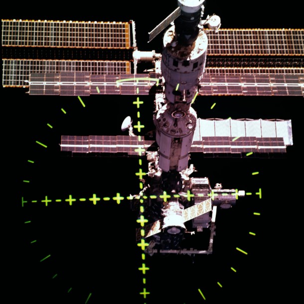 ISS seen from the Space Shuttle after undocking. This view was captured with a 70mm handheld camera through the Space Shuttle Discovery's crew optical alignment system (COAS) during separation operations. The undocking took place at 9:52 (CDT) on 20 August 2001. Credits: NASA ISS seen from the Space Shuttle after undocking. This view was captured with a 70mm handheld camera through the Space Shuttle Discovery's crew optical alignment system (COAS) during separation operations. The undocking took place at 9:52 (CDT) on 20 August 2001. Credits: NASA