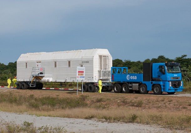 A purpose-built vehicle for the transportation of hydrogen peroxide to the Soyuz launch pad is pictured during its rollout this month. Pulled by the Spaceport’s multi-purpose Titan tug, the wheeled vehicle was partially filled with hydrogen peroxide to validate the delivery process. In the photo, it is seen leaving the Soyuz facility’s preparation area on its way to the launch pad. A purpose-built vehicle for the transportation of hydrogen peroxide to the Soyuz launch pad is pictured during its rollout this month. Pulled by the Spaceport’s multi-purpose Titan tug, the wheeled vehicle was partially filled with hydrogen peroxide to validate the delivery process. In the photo, it is seen leaving the Soyuz facility’s preparation area on its way to the launch pad.