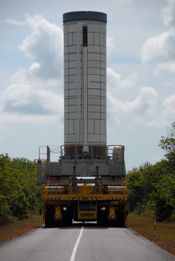 The P80 first stage’s departs from the Spaceport’s Booster Integration Building on a low-slung transporter vehicle, and then moves into the Vega launch zone. The P80 first stage’s departs from the Spaceport’s Booster Integration Building on a low-slung transporter vehicle, and then moves into the Vega launch zone.