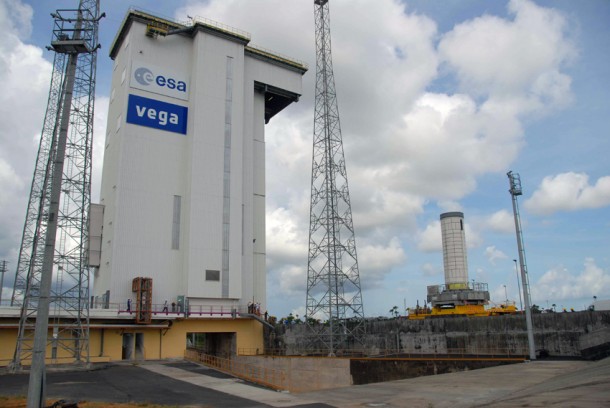 The P80 first stage departs from the Spaceport’s Booster Integration Building on a low-slung transporter vehicle, and then moves into the Vega launch zone. The P80 first stage departs from the Spaceport’s Booster Integration Building on a low-slung transporter vehicle, and then moves into the Vega launch zone.