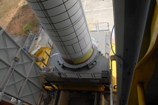 The P80 stage is transferred atop its pallet onto the launch pad through the gantry’s two open doors. The P80 stage is transferred atop its pallet onto the launch pad through the gantry’s two open doors.