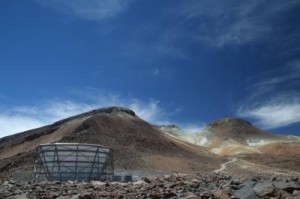 The Atacama Cosmology Telescope (ACT) in the Atacama Desert of northern Chile, with Cerro Toco volcanic peak in the background. Astronomers conducted a large, uniform survey of the southern sky with ACT, using a breakthrough technique that detects "shadows" of galaxy clusters on the cosmic microwave background radiation. The shadows pointed astronomers to previously unseen massive galaxy clusters. Credit: Adam Hincks, Princeton University, University of Toronto The Atacama Cosmology Telescope (ACT) in the Atacama Desert of northern Chile, with Cerro Toco volcanic peak in the background. Astronomers conducted a large, uniform survey of the southern sky with ACT, using a breakthrough technique that detects "shadows" of galaxy clusters on the cosmic microwave background radiation. The shadows pointed astronomers to previously unseen massive galaxy clusters. Credit: Adam Hincks, Princeton University, University of Toronto