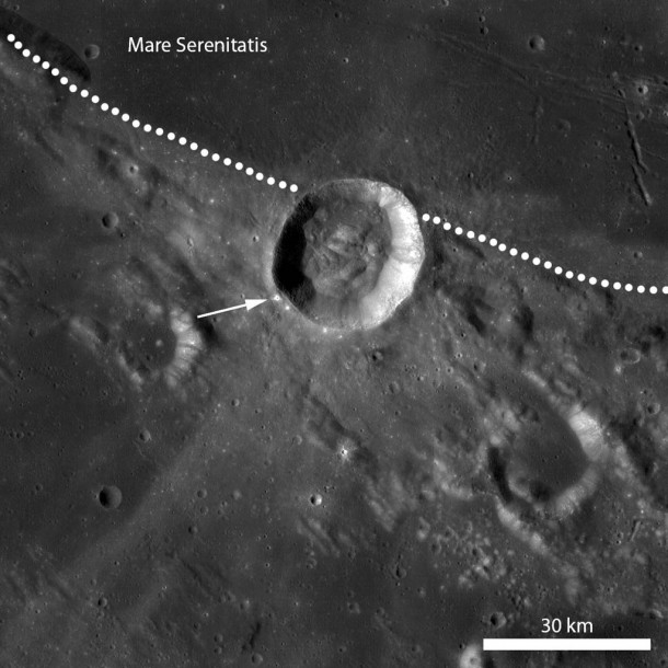 LROC Wide Angle Camera mosaic of Menelaus crater at the boundary between Mare Serenitatis and the highlands (dotted line). Broad ejecta rays extend along the mare-highlands boundary and also in the NE-SW direction. In this image, the ejecta ray extending to the SW is easier to distinguish than the ray extending into Mare Serenitatis. The arrow marks the location of a recent 350 m diameter impact near the rim of Menelaus crater. Credit: NASA/GSFC/Arizona State University LROC Wide Angle Camera mosaic of Menelaus crater at the boundary between Mare Serenitatis and the highlands (dotted line). Broad ejecta rays extend along the mare-highlands boundary and also in the NE-SW direction. In this image, the ejecta ray extending to the SW is easier to distinguish than the ray extending into Mare Serenitatis. The arrow marks the location of a recent 350 m diameter impact near the rim of Menelaus crater. Credit: NASA/GSFC/Arizona State University