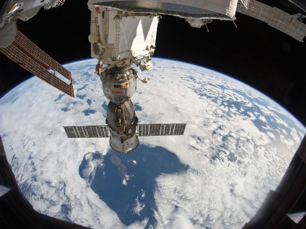 t 220 miles above Earth, the unattended Soyuz TMA-19 spacecraft, docked to the International Space Station, almost appears to be a giant telescope focusing through a break in the clouds upon several islands in the Galapagos chain. Isabela is the most easily recognizable island among this chain in the Pacific Ocean. Credit: NASA t 220 miles above Earth, the unattended Soyuz TMA-19 spacecraft, docked to the International Space Station, almost appears to be a giant telescope focusing through a break in the clouds upon several islands in the Galapagos chain. Isabela is the most easily recognizable island among this chain in the Pacific Ocean. Credit: NASA