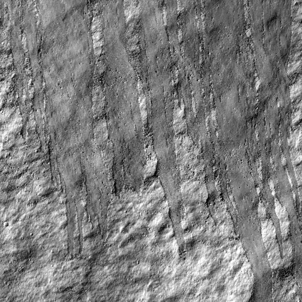 Northern slope inside Robinson crater. LROC NAC M114259768R, 0.52 m/pixel, image width is 620 m, sun light is from right side. Slope direction is from top to the bottom of the image Credit: NASA/GSFC/Arizona State University. Northern slope inside Robinson crater. LROC NAC M114259768R, 0.52 m/pixel, image width is 620 m, sun light is from right side. Slope direction is from top to the bottom of the image Credit: NASA/GSFC/Arizona State University.