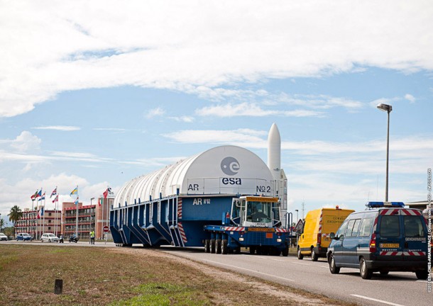 The protective container with Ariane 5’s cryogenic core stage enters the main base area of the Spaceport. Credit: Arianespace The protective container with Ariane 5’s cryogenic core stage enters the main base area of the Spaceport. Credit: Arianespace