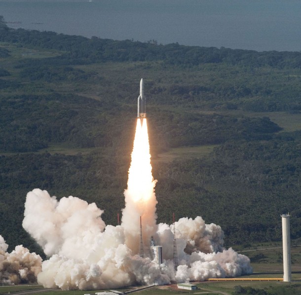 This aerial photo details Ariane 5’s initial climb-out from the ELA 3 launch zone at Europe’s Spaceport, which is located adjacent to the Atlantic Ocean coastline in French Guiana. This aerial photo details Ariane 5’s initial climb-out from the ELA 3 launch zone at Europe’s Spaceport, which is located adjacent to the Atlantic Ocean coastline in French Guiana.