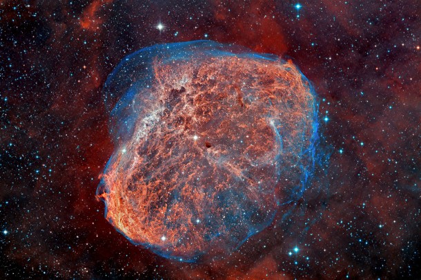 This image of the Crescent Nebula or NGC 6888 was obtained using the Wide Field Camera on the Isaac Newton Telescope. It is a three-colour composite made from data collected using filters to isolate the light emitted by hydrogen alpha (H-alpha) and doubly ionised oxygen (OIII) atoms, and coded in the image as red, green (25% H-alpha and 75% OIII) and blue. Credit: D. López (IAC) This image of the Crescent Nebula or NGC 6888 was obtained using the Wide Field Camera on the Isaac Newton Telescope. It is a three-colour composite made from data collected using filters to isolate the light emitted by hydrogen alpha (H-alpha) and doubly ionised oxygen (OIII) atoms, and coded in the image as red, green (25% H-alpha and 75% OIII) and blue. Credit: D. López (IAC)