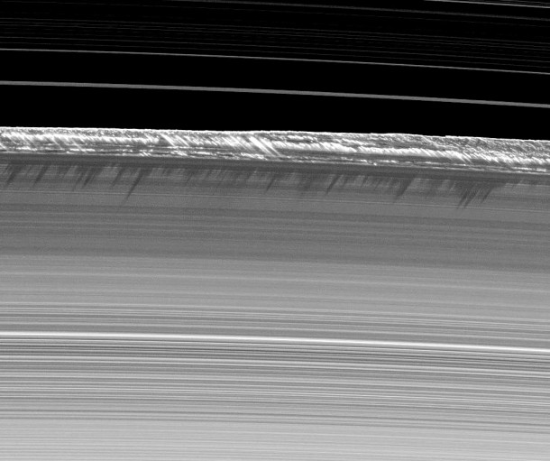 Vertical structures, among the tallest seen in Saturn's main rings, rise abruptly from the edge of Saturn's B ring to cast long shadows on the ring in this image taken by NASA's Cassini spacecraft two weeks before the planet's August 2009 equinox. Credit: NASA/JPL/SSI Vertical structures, among the tallest seen in Saturn's main rings, rise abruptly from the edge of Saturn's B ring to cast long shadows on the ring in this image taken by NASA's Cassini spacecraft two weeks before the planet's August 2009 equinox. Credit: NASA/JPL/SSI