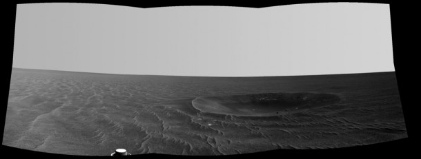 "Yankee Clipper" crater on Mars carries the name of the command and service module of NASA's 1969 Apollo 12 mission to the moon. Opportunity recorded this view of the crater during a pause in a 102-meter (365-foot) drive during the 2,410th Martian day of the rover's work on Mars (Nov. 4, 2010). "Yankee Clipper" crater on Mars carries the name of the command and service module of NASA's 1969 Apollo 12 mission to the moon. Opportunity recorded this view of the crater during a pause in a 102-meter (365-foot) drive during the 2,410th Martian day of the rover's work on Mars (Nov. 4, 2010).