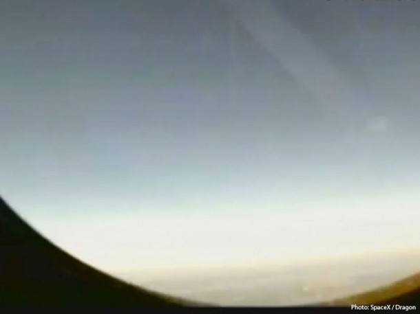 View from orbit from the side window of the Dragon spacecraft, received via video as it passed over Hawaii during its first orbit. Credit: SpaceX View from orbit from the side window of the Dragon spacecraft, received via video as it passed over Hawaii during its first orbit. Credit: SpaceX