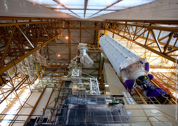 Ariane 5’s core cryogenic stage is raised for its positioning over the mobile launch table inside the Spaceport’s Launcher Integration Building. Credit: Arianespace Ariane 5’s core cryogenic stage is raised for its positioning over the mobile launch table inside the Spaceport’s Launcher Integration Building. Credit: Arianespace