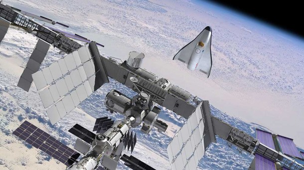 Orbital's proposed space vehicle for NASA's Commercial Crew Development-2 program is depicted in rendezvous and berthing operations with the International Space Station Orbital's proposed space vehicle for NASA's Commercial Crew Development-2 program is depicted in rendezvous and berthing operations with the International Space Station