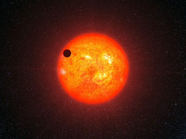 This artist’s impression shows the super-Earth exoplanet GJ 1214b passing in front of its faint red parent star. This is the first super-Earth exoplanet to have had its atmosphere analysed. GJ 1214b appears to be surrounded by an atmosphere that is either dominated by steam or blanketed by thick clouds or hazes. Credit: ESO/L. Calçada This artist’s impression shows the super-Earth exoplanet GJ 1214b passing in front of its faint red parent star. This is the first super-Earth exoplanet to have had its atmosphere analysed. GJ 1214b appears to be surrounded by an atmosphere that is either dominated by steam or blanketed by thick clouds or hazes. Credit: ESO/L. Calçada